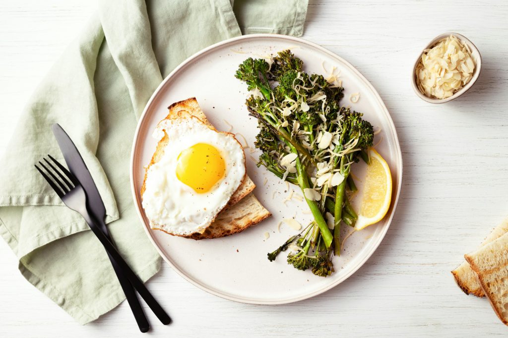 Healthy Breakfast with Broccolini, Fried Egg and Tost.