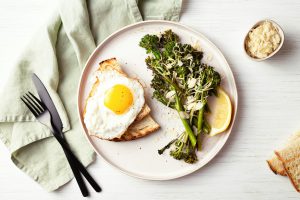 Healthy Breakfast with Broccolini, Fried Egg and Tost.